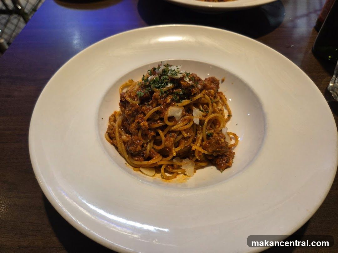 Spaghetti dish served in a white bowl