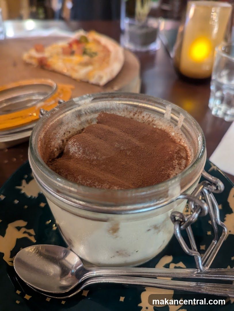Dessert and Pizza at Restaurant Table