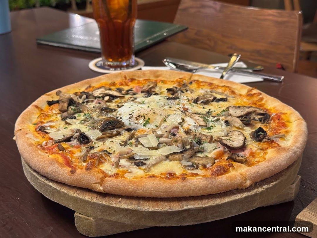 Pizza and beverage at dining table