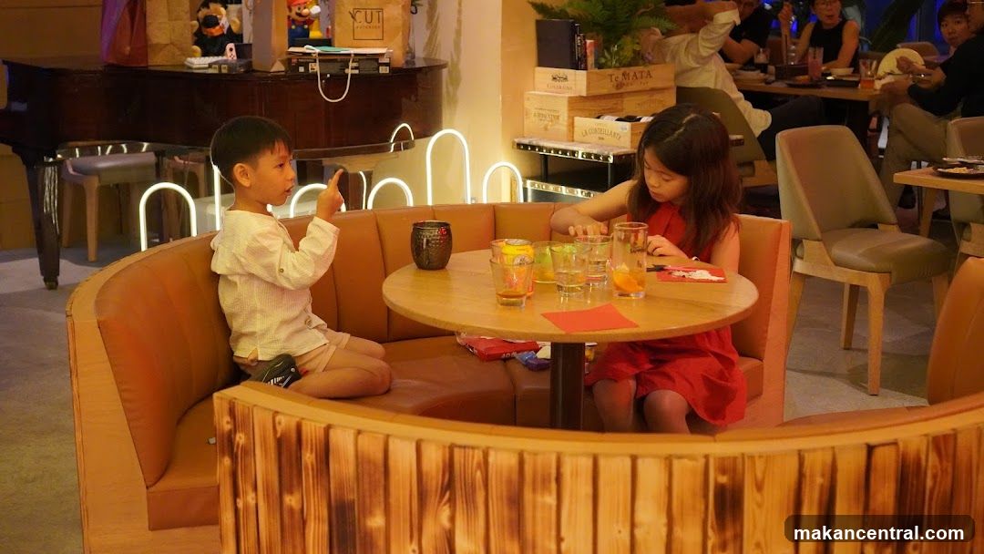 Children at a restaurant booth