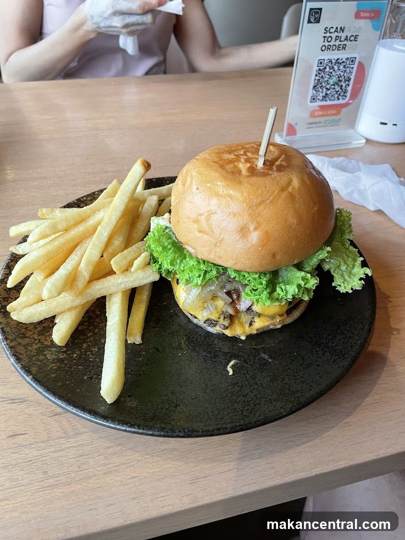 Burger and fries at table