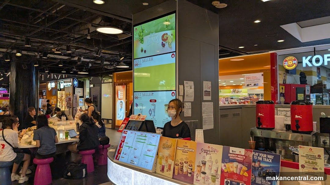 Food court interior with staff and customers