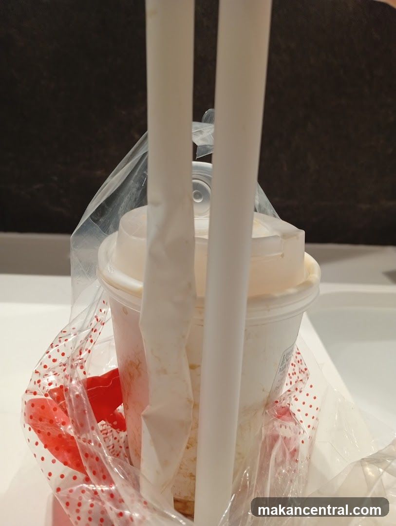Cup with Straws in Plastic Bag