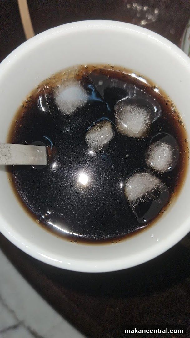 Iced beverage in white cup