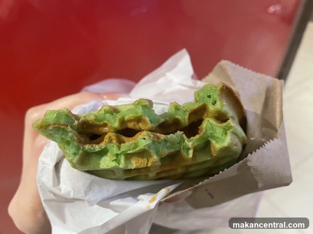 Hand holding green waffle