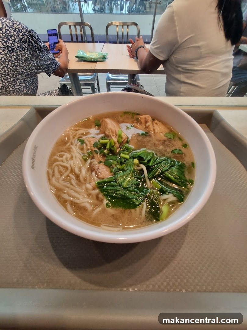 Bowl of Noodle Soup in Food Court