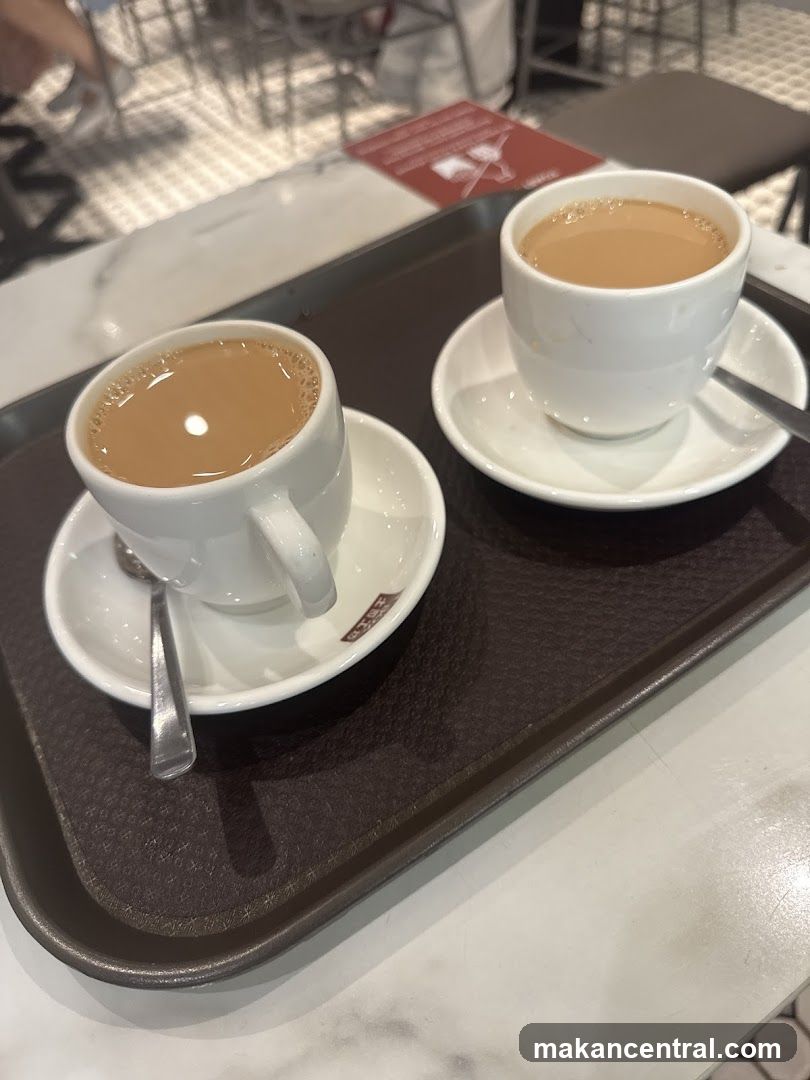 Two cups of tea on a tray