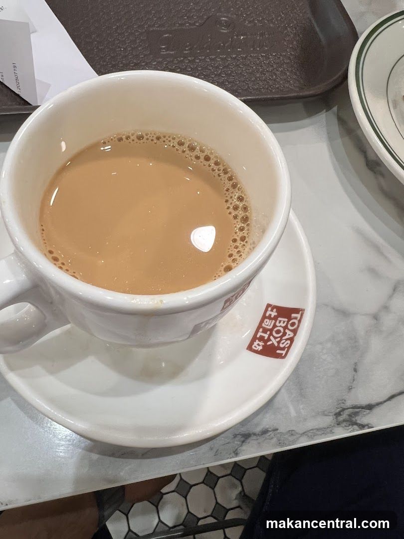 Toasted beverage in cup on saucer