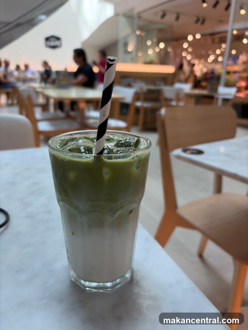 Matcha Iced Drink in Café Interior