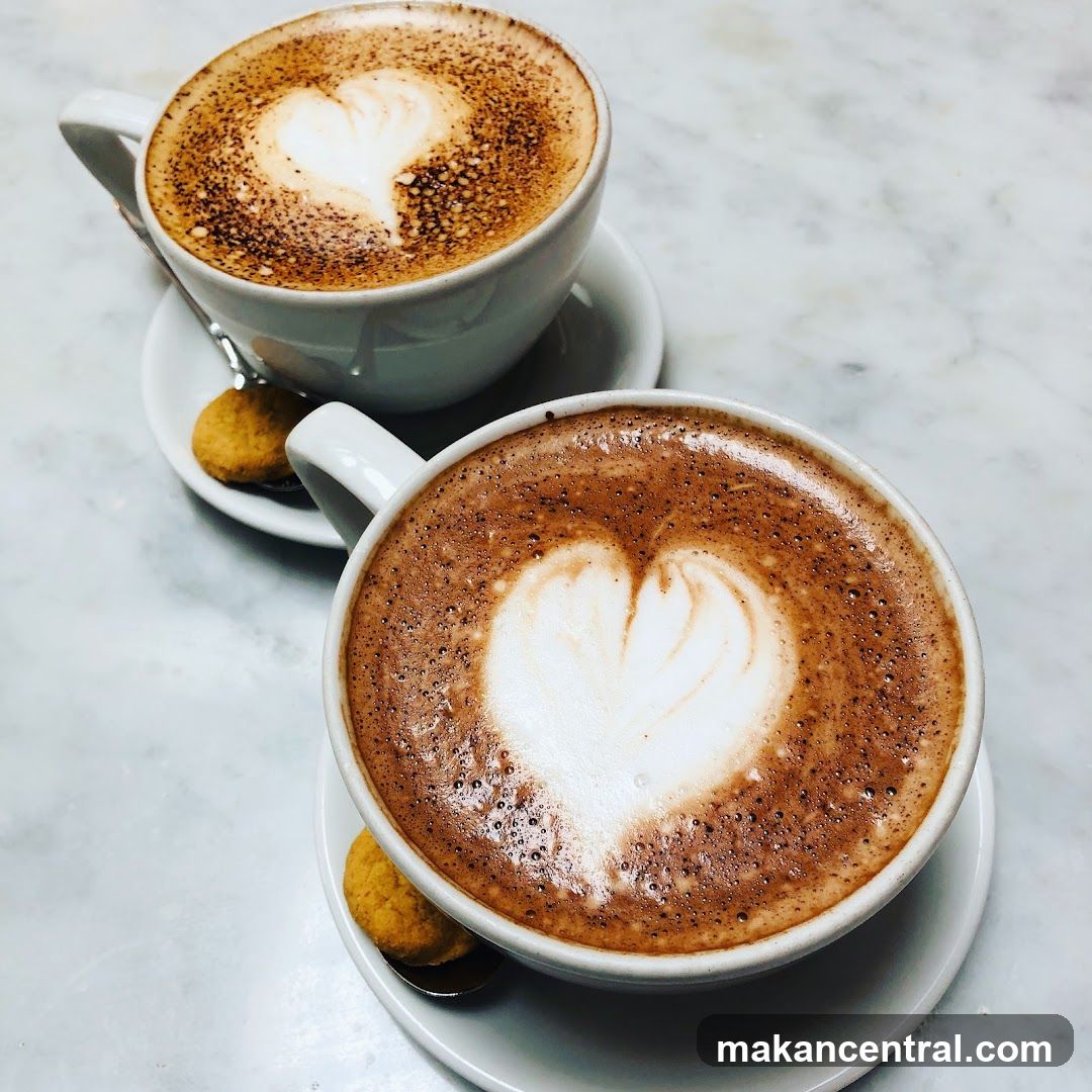 Two coffee cups with heart latte art