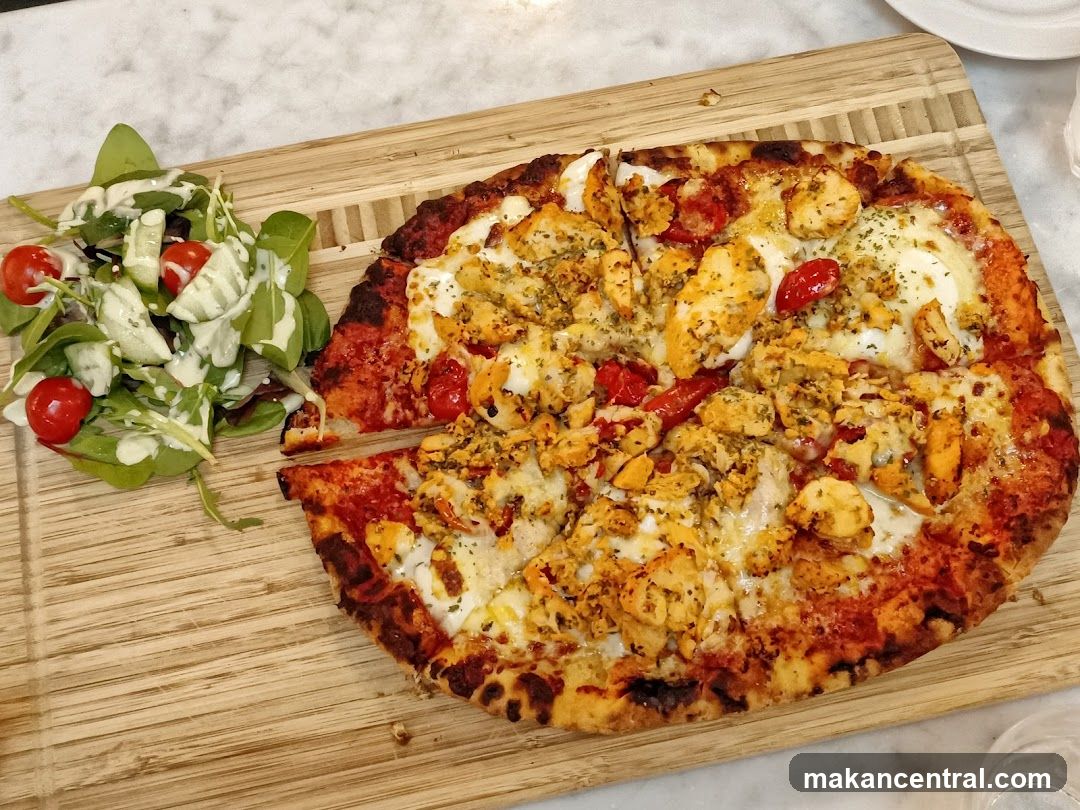 Pizza and Salad on Wooden Board