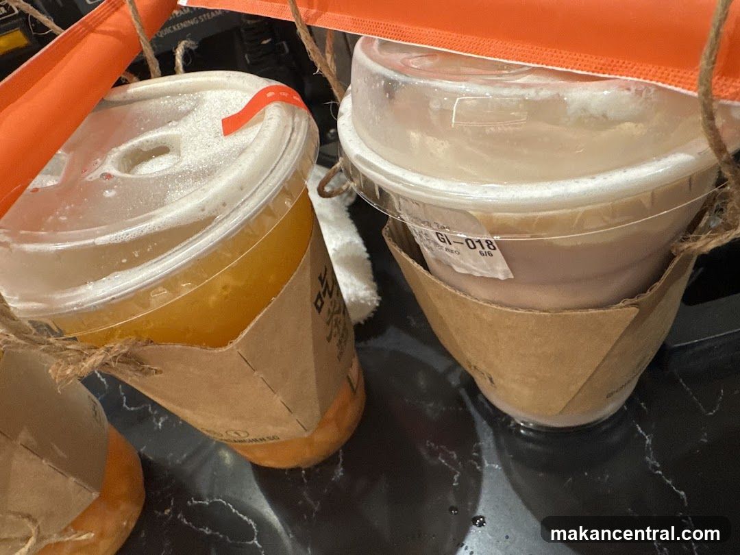 Two beverages in takeout cups