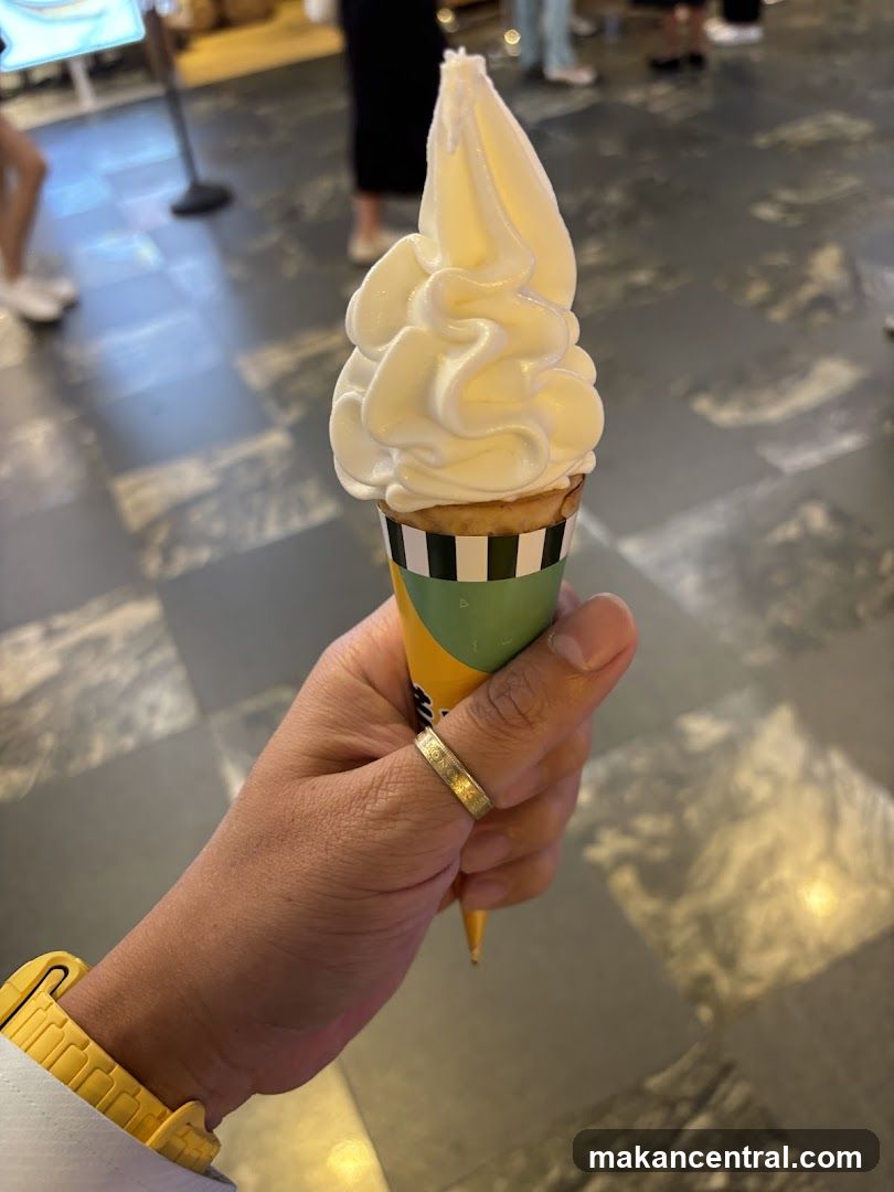 Hand holding soft serve ice cream