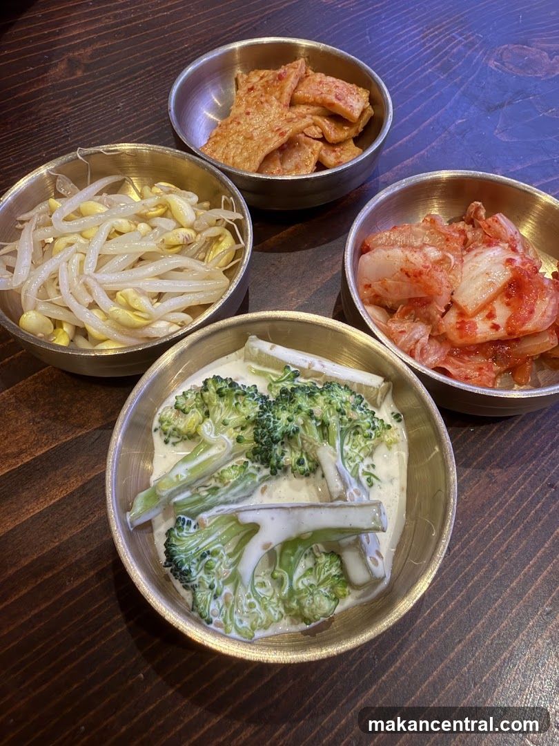 Korean side dishes served in metal bowls