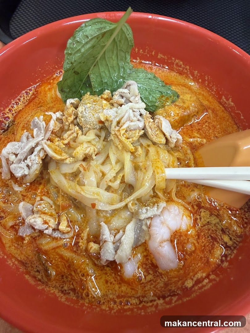 Laksa in red bowl