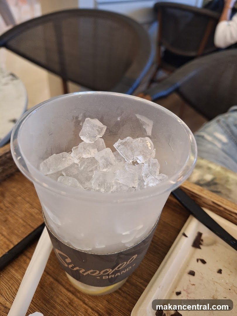 Cup of iced drink in a branded cup