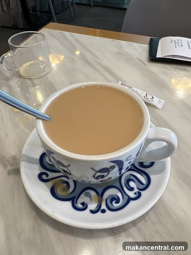Table with tea cup and glass
