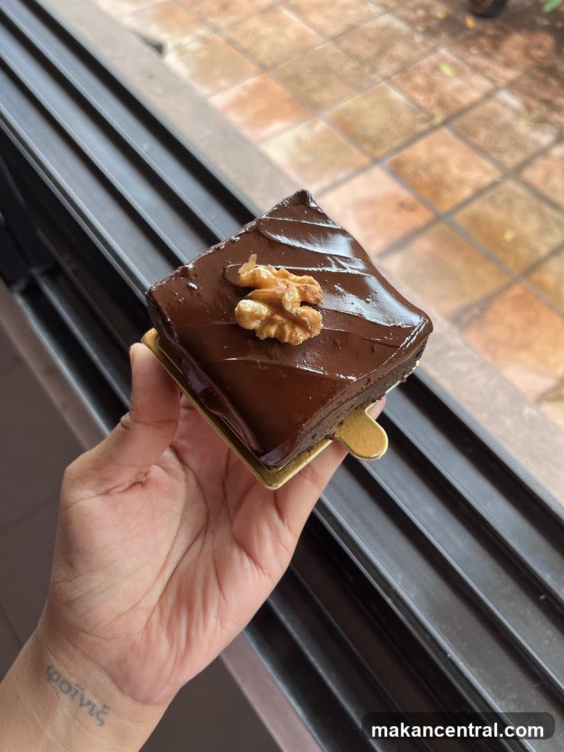 Hand holding chocolate dessert