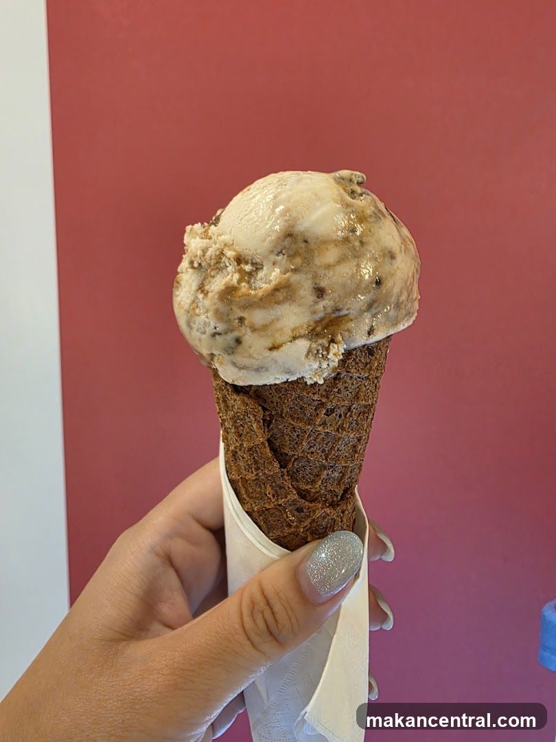 Hand holding ice cream cone
