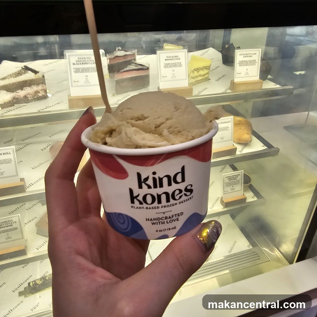 Hand holding Kind Kones ice cream