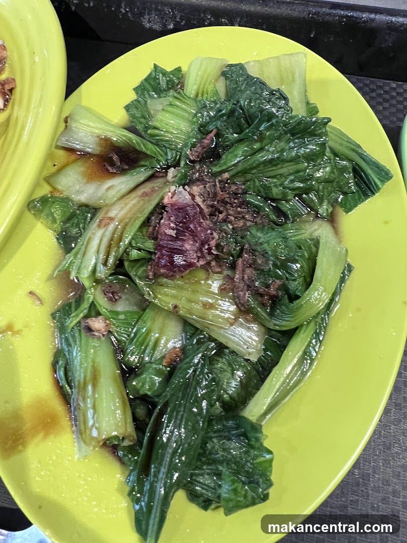 Cooked greens on a yellow plate