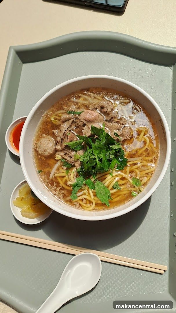 Bowl of Noodle Soup with Side Dishes