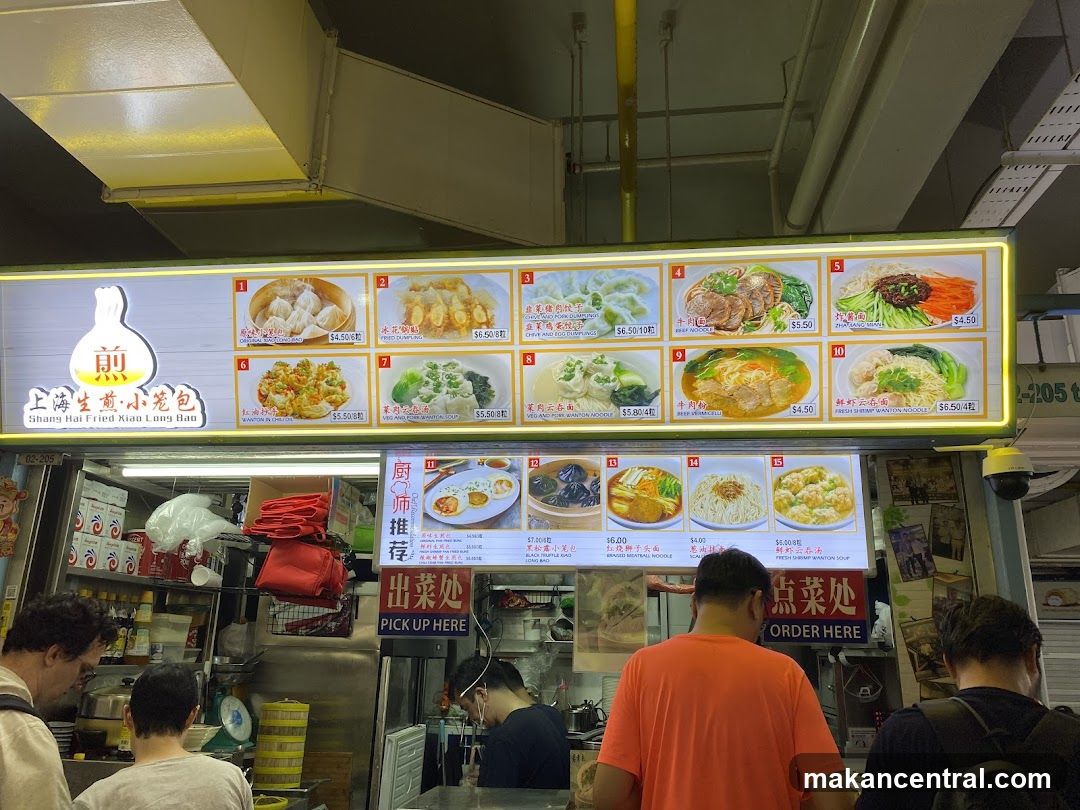 Food stall interior with customers and staff