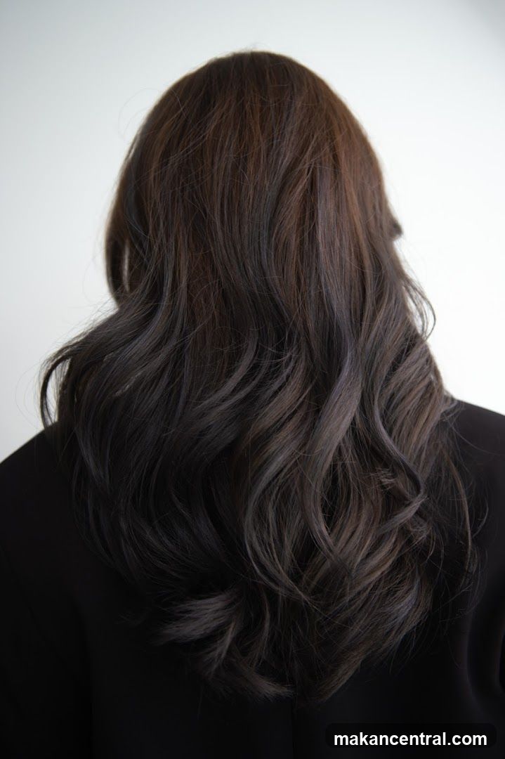Back view of person with long wavy hair