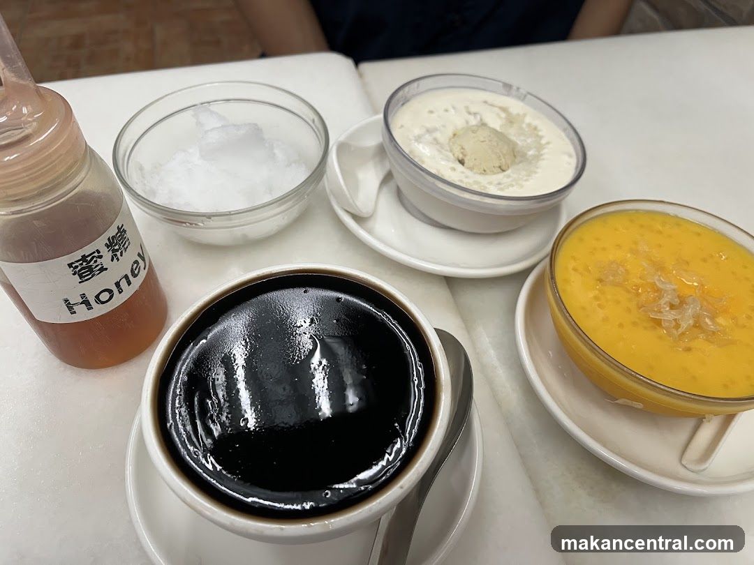 Table with Desserts and Honey Bottle