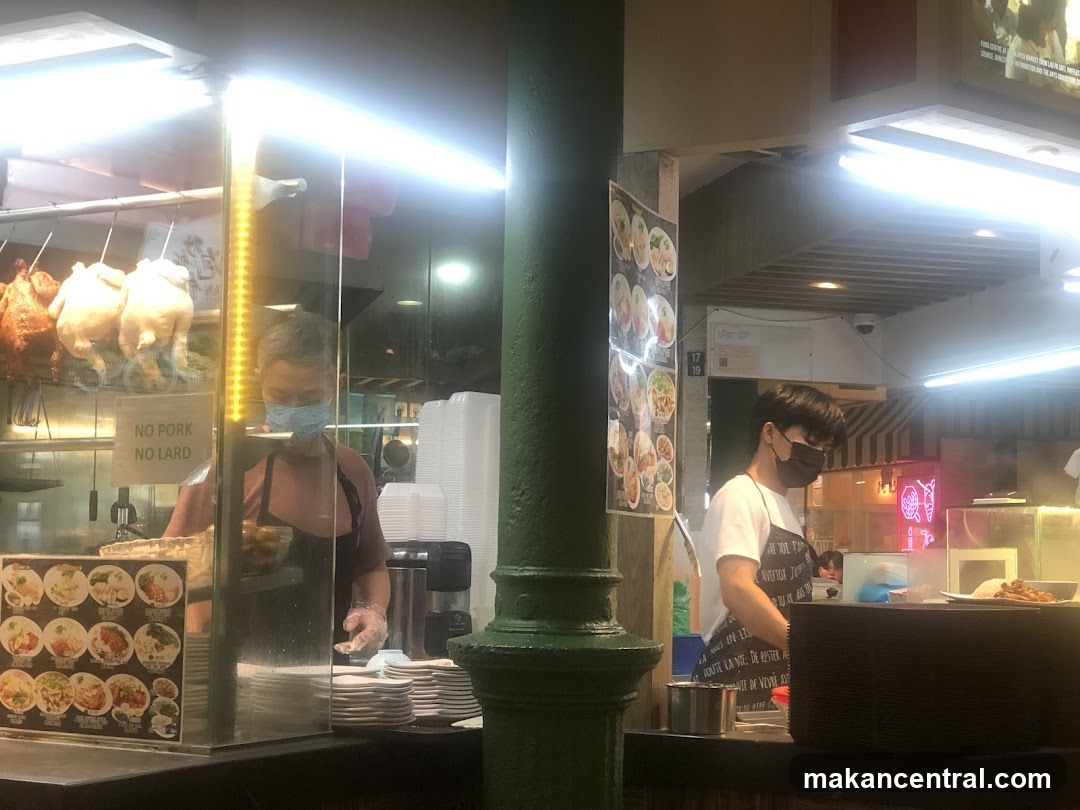 Food stall interior with staff and equipment