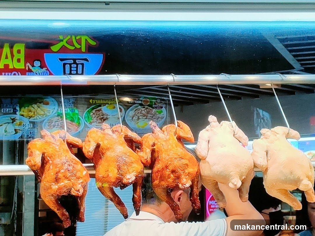 Roasted chickens hanging at food stall