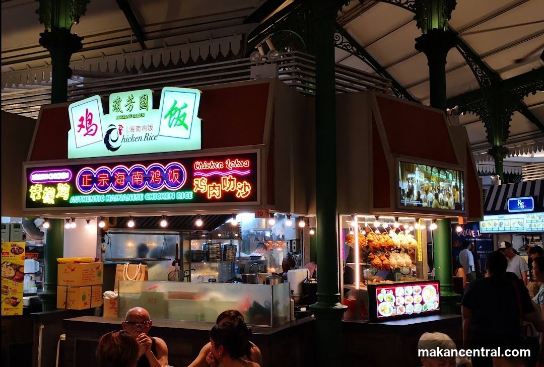 Food stall interior with neon signage