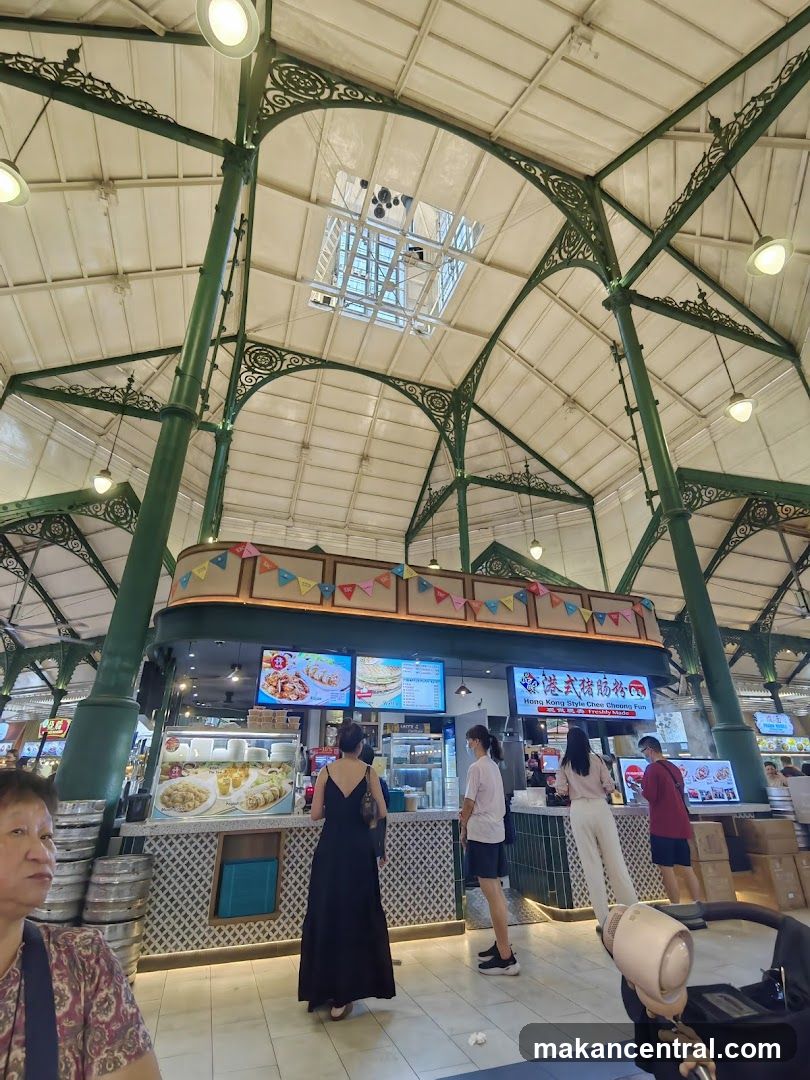Interior of a food court with ornate green metal framework