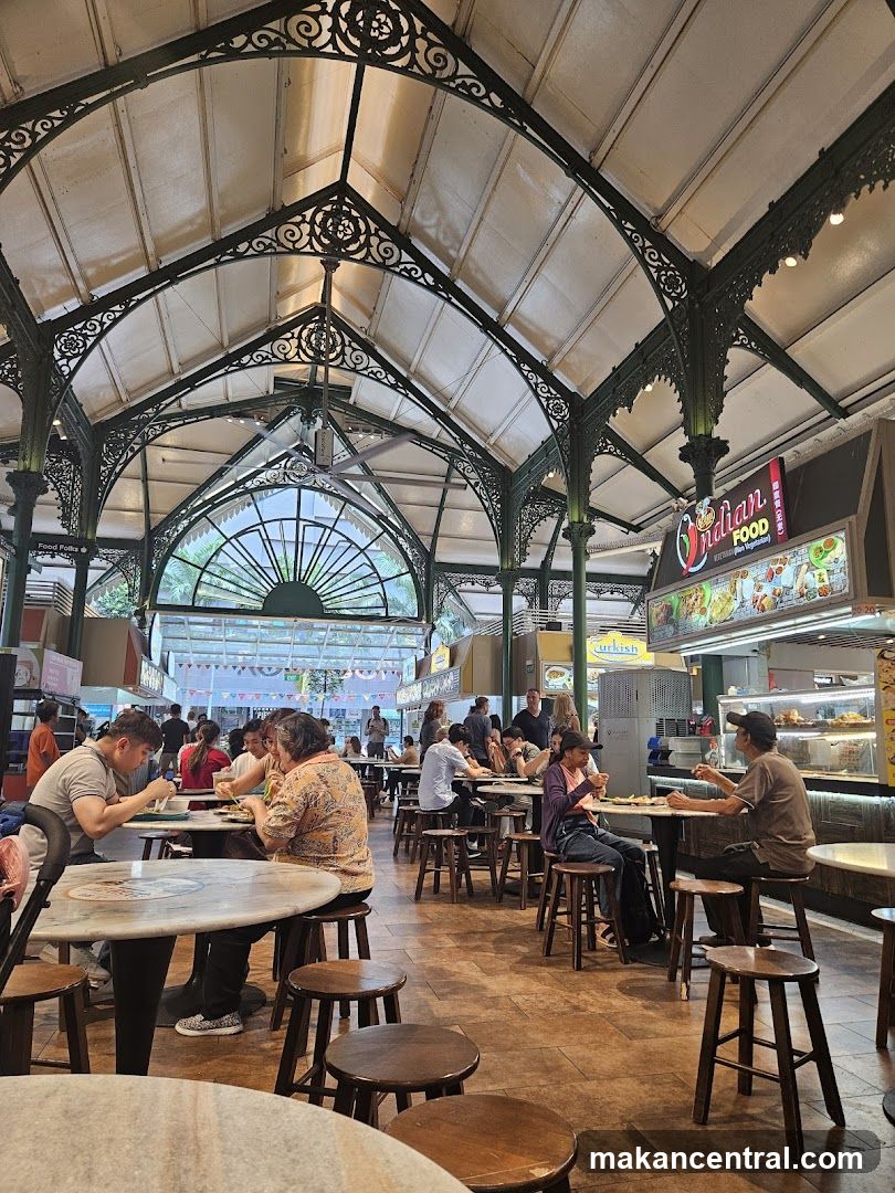 Indoor food court with ornate metal ceiling