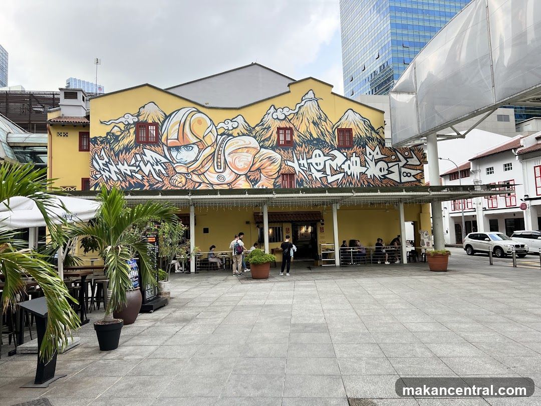 Outdoor plaza with graffiti mural