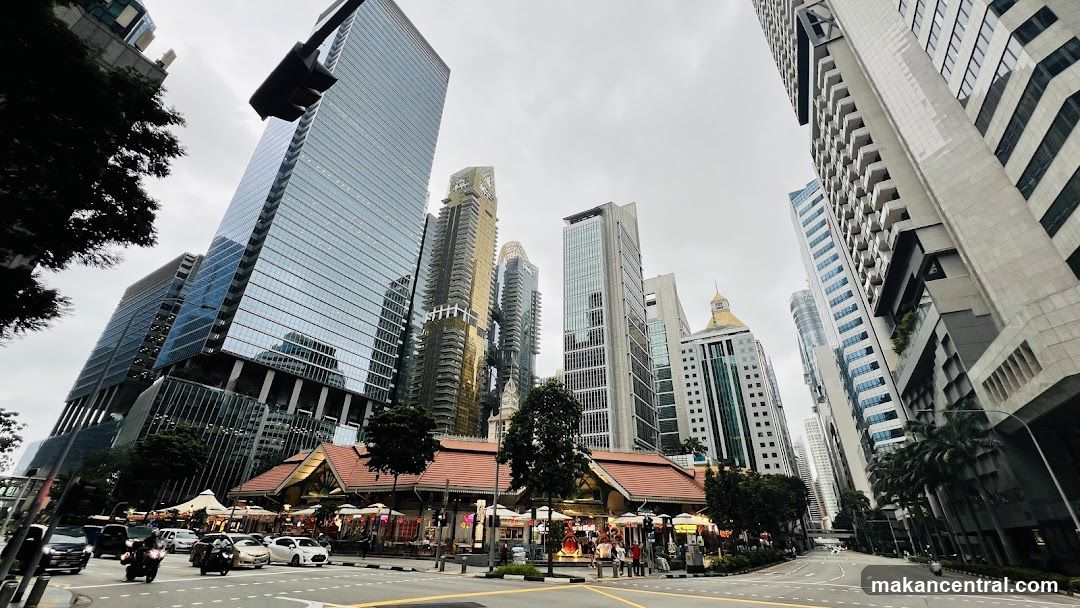 Urban street scene with modern skyscrapers and a traditional shopfront