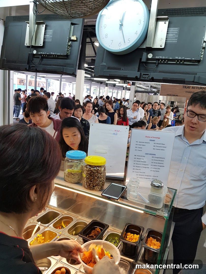 Food stall interior with customers and staff