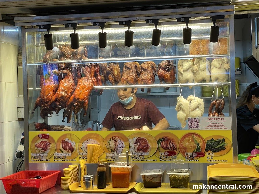 Food stall interior with roasted meats display