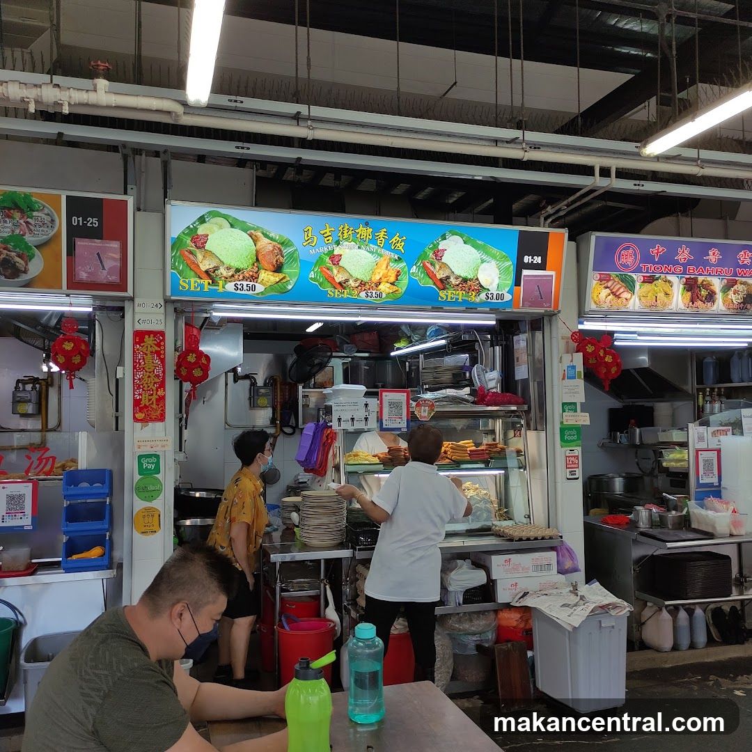 Food stall interior with customers and staff