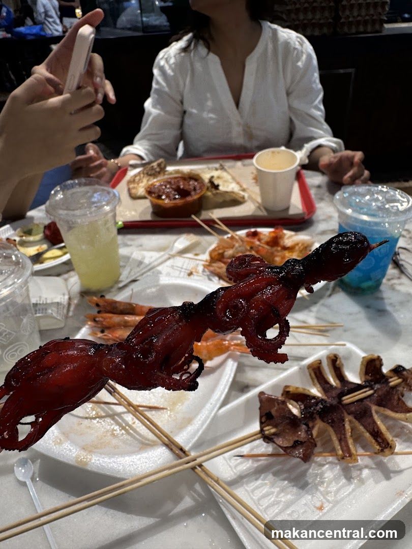 Dining Scene with Seafood Skewers