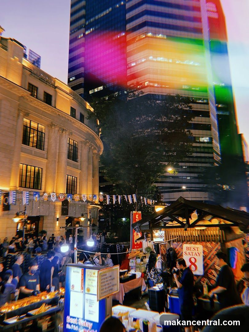 Nighttime Street Food Market with Urban Backdrop