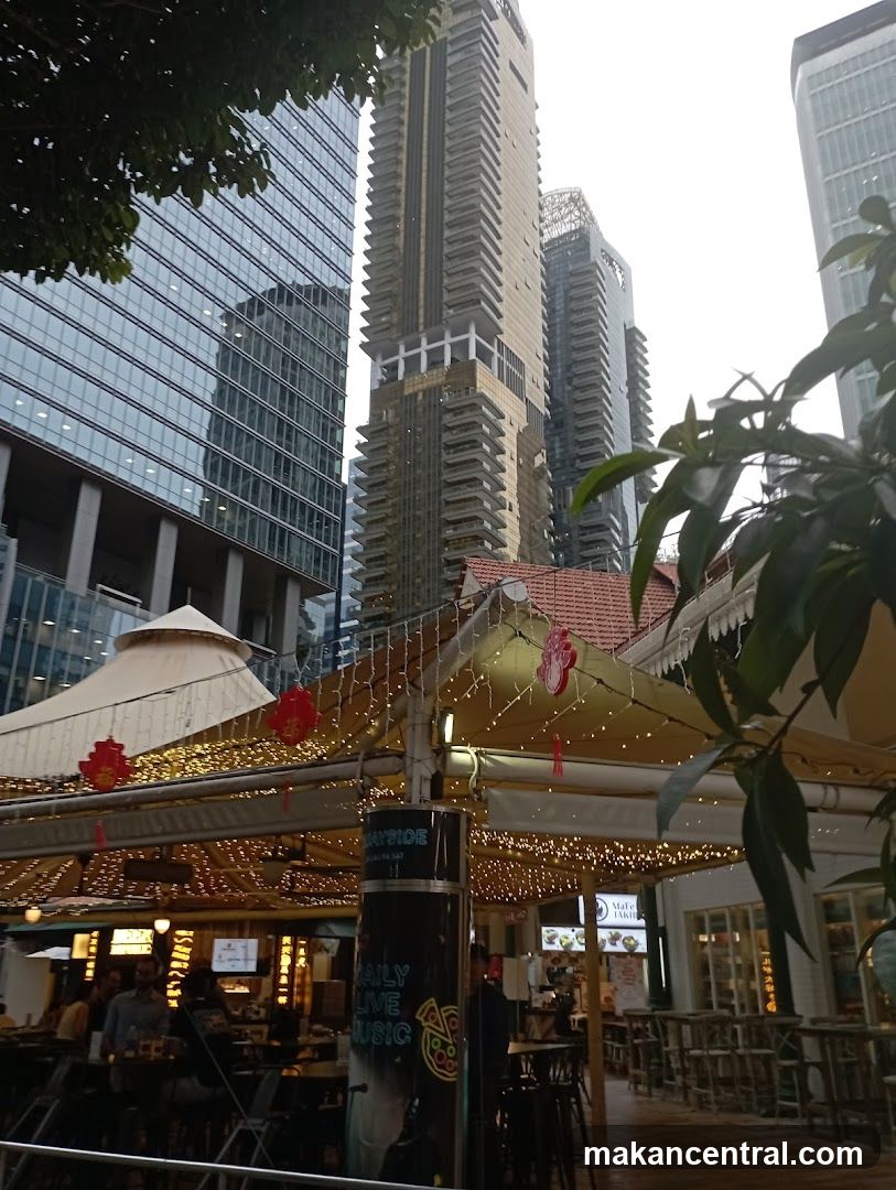 Outdoor dining area with urban backdrop