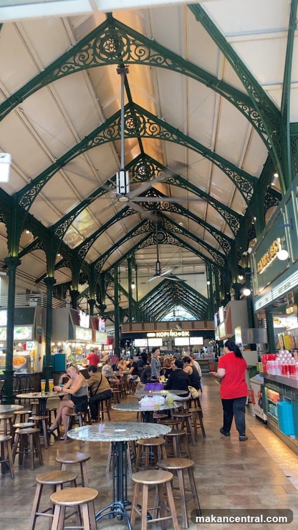 Indoor food court with ornate green metal ceiling