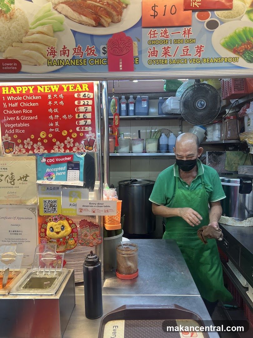 Food stall interior with staff preparing food