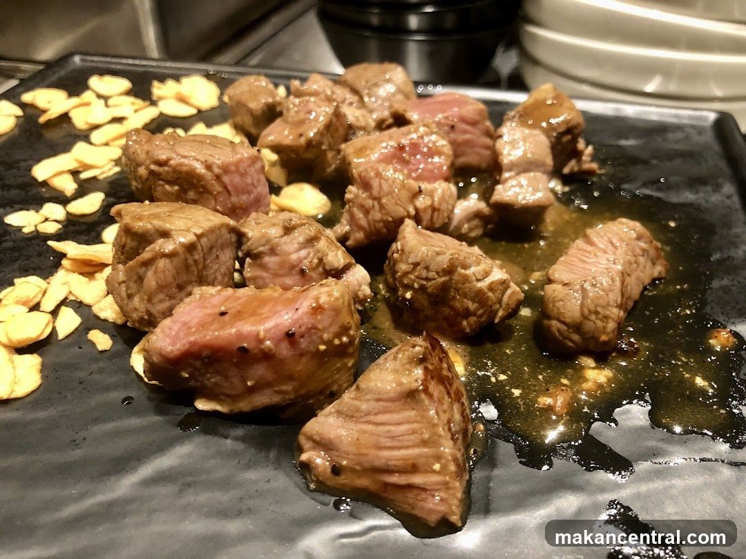 Grilled Meat and Garlic on Plate