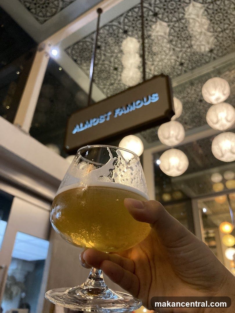 Hand holding beer glass inside a venue