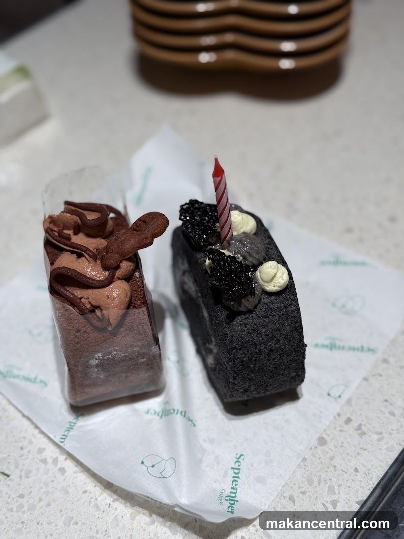 Two cakes on branded paper