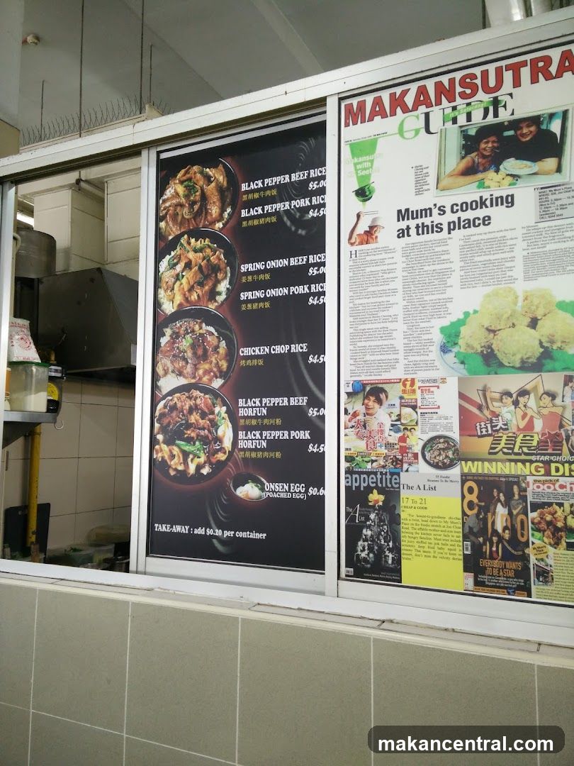 Restaurant storefront with menu board and newspaper clippings
