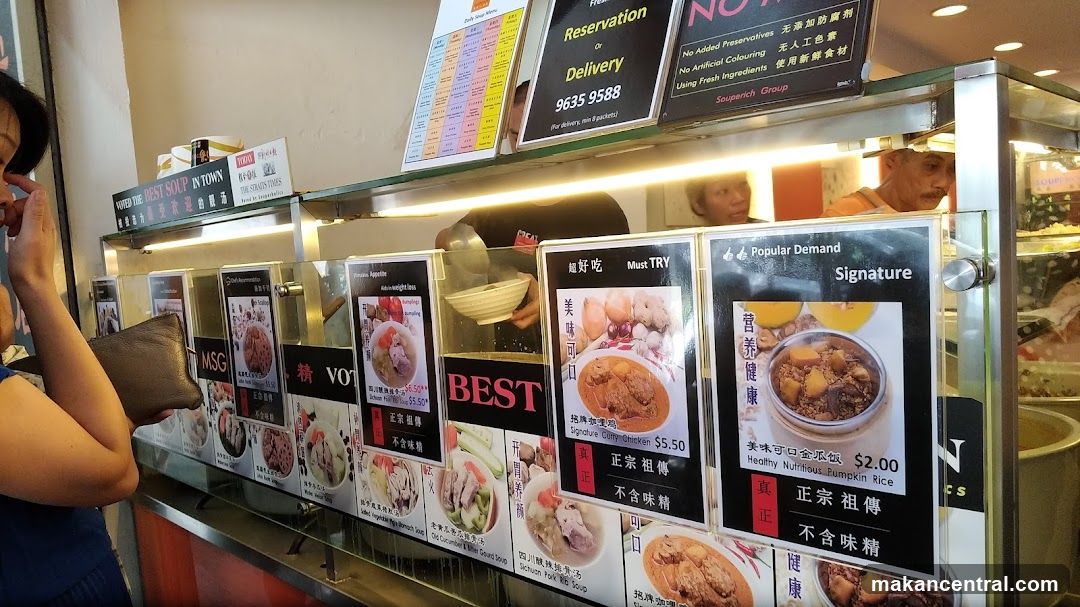 Food stall interior with customer and staff