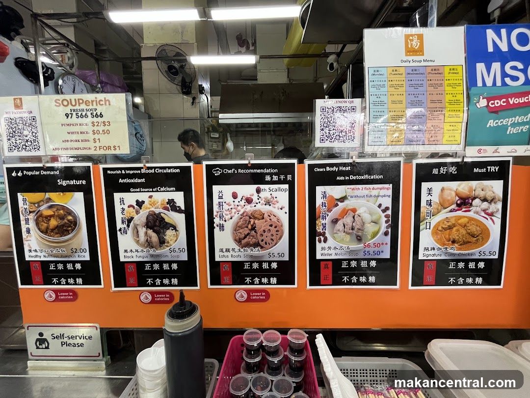 Soup stall interior with promotional boards